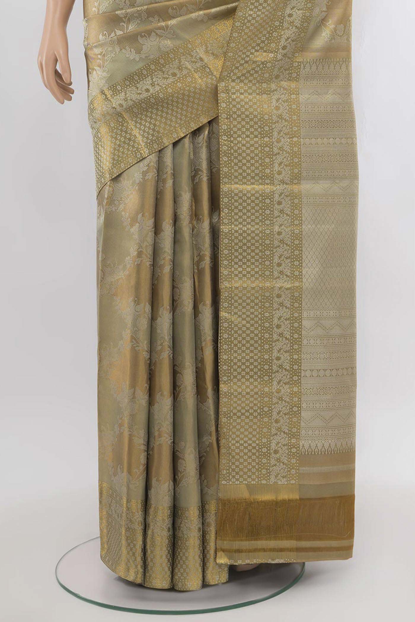 Pleats and pallu of Golden Kanjivaram Silk Saree with Zari Butta on the body and Silk Border. 
