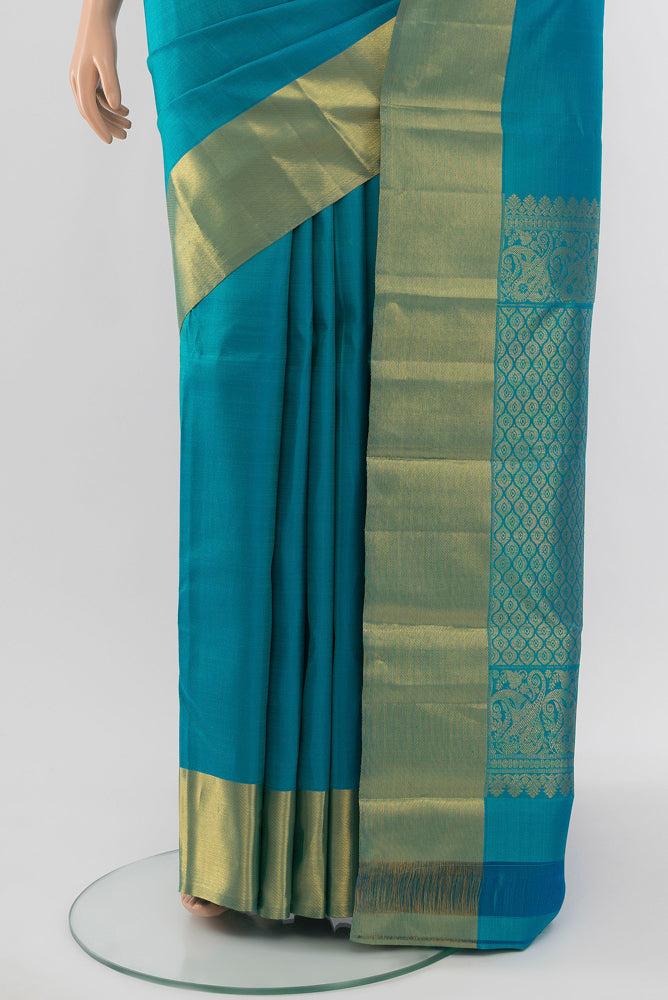 Pleats and pallu of Light Blue Kanjivaram Silk Saree with Zari Butta on the body and Silk Border. 