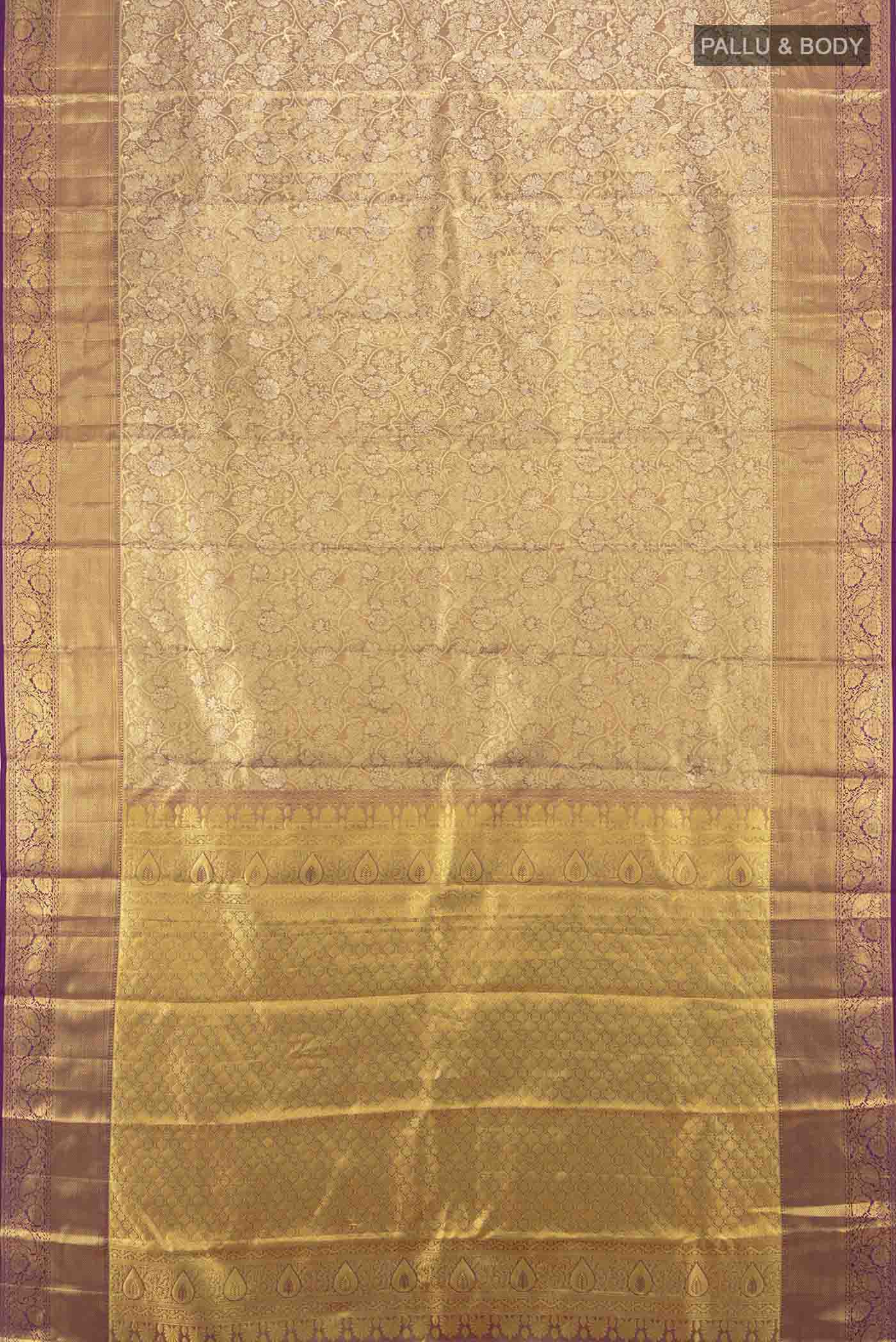 Flat view of Golden Kanchipuram Silk Saree with Zari Butta on the body and Silk Border. 