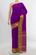 Purple Kanjivaram Silk Saree with Zari Butta on the body and Silk Border.  displayed on a mannequin