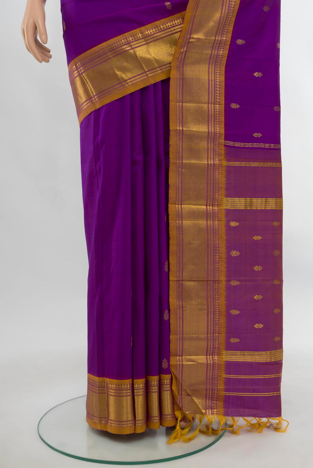 Pleats and pallu of Purple Kanjivaram Silk Saree with Zari Butta on the body and Silk Border. 