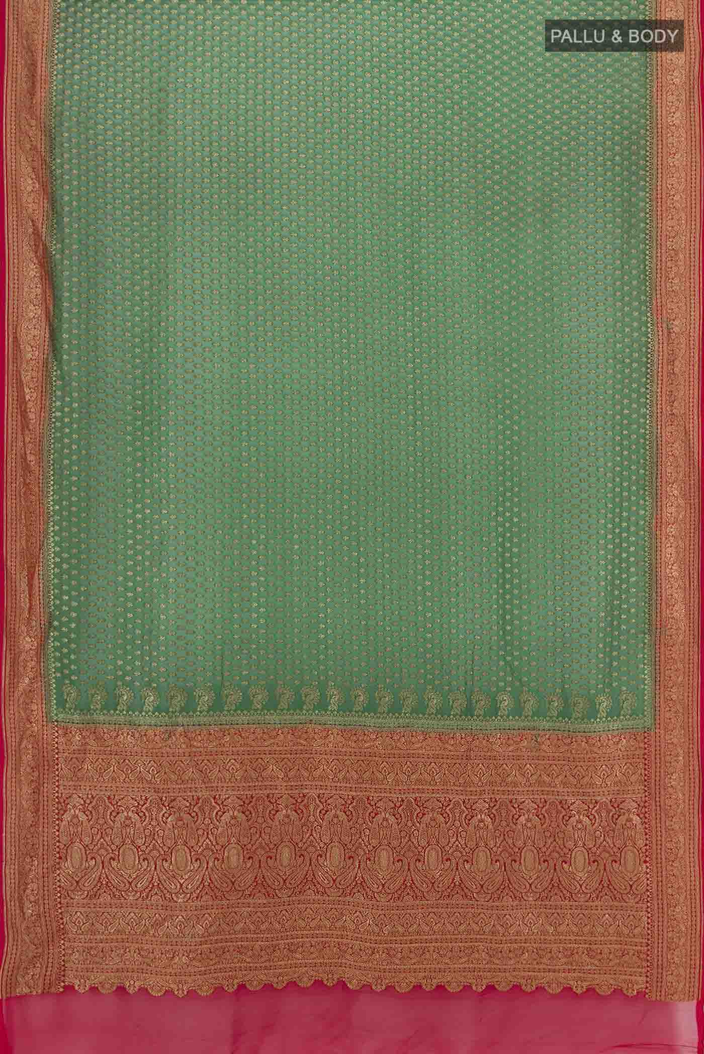 Flat view of Bottle Green Banarasi Georgette Saree with Zari Butta on the body and Silk Border. 