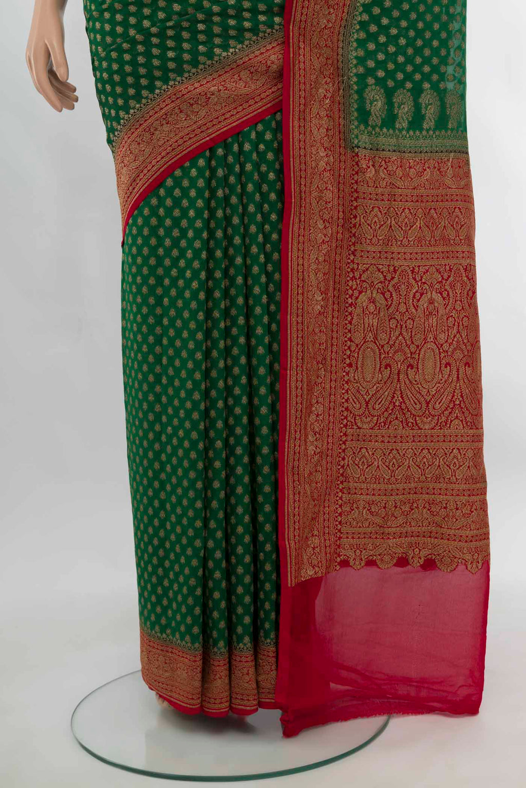 Pleats and pallu of Bottle Green Banarasi Georgette Saree with Zari Butta on the body and Silk Border. 