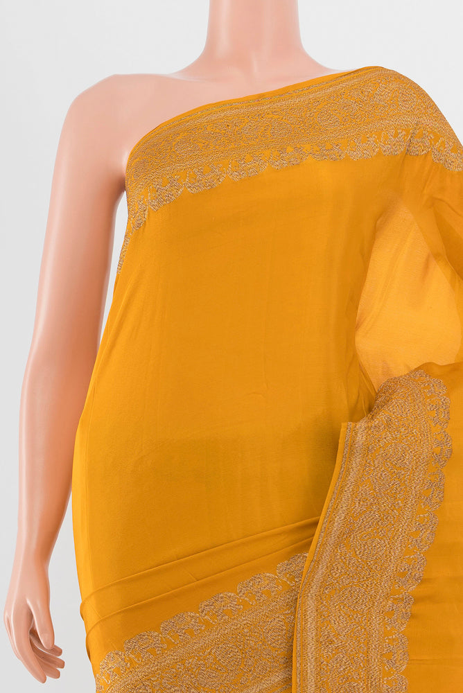 Border image of Mustard Mysore Crepe Saree with Zari Butta on the body and Silk Border. 