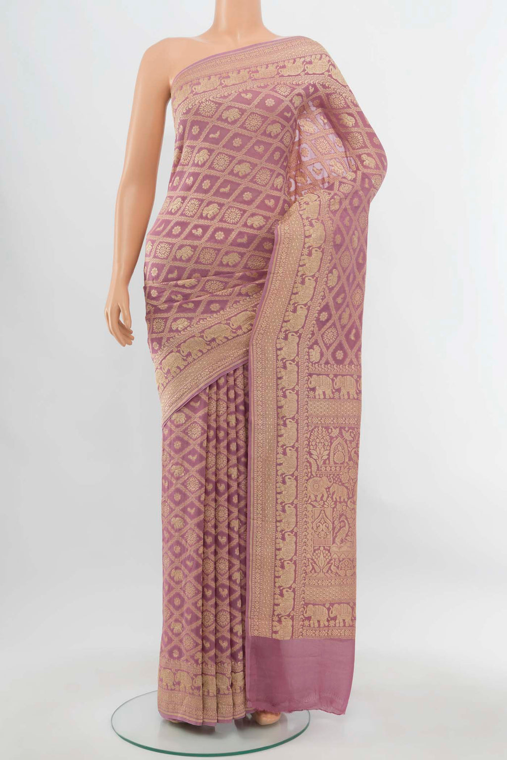 Golden Banarasi Georgette Saree with Zari Butta on the body and Silk Border.  displayed on a mannequin