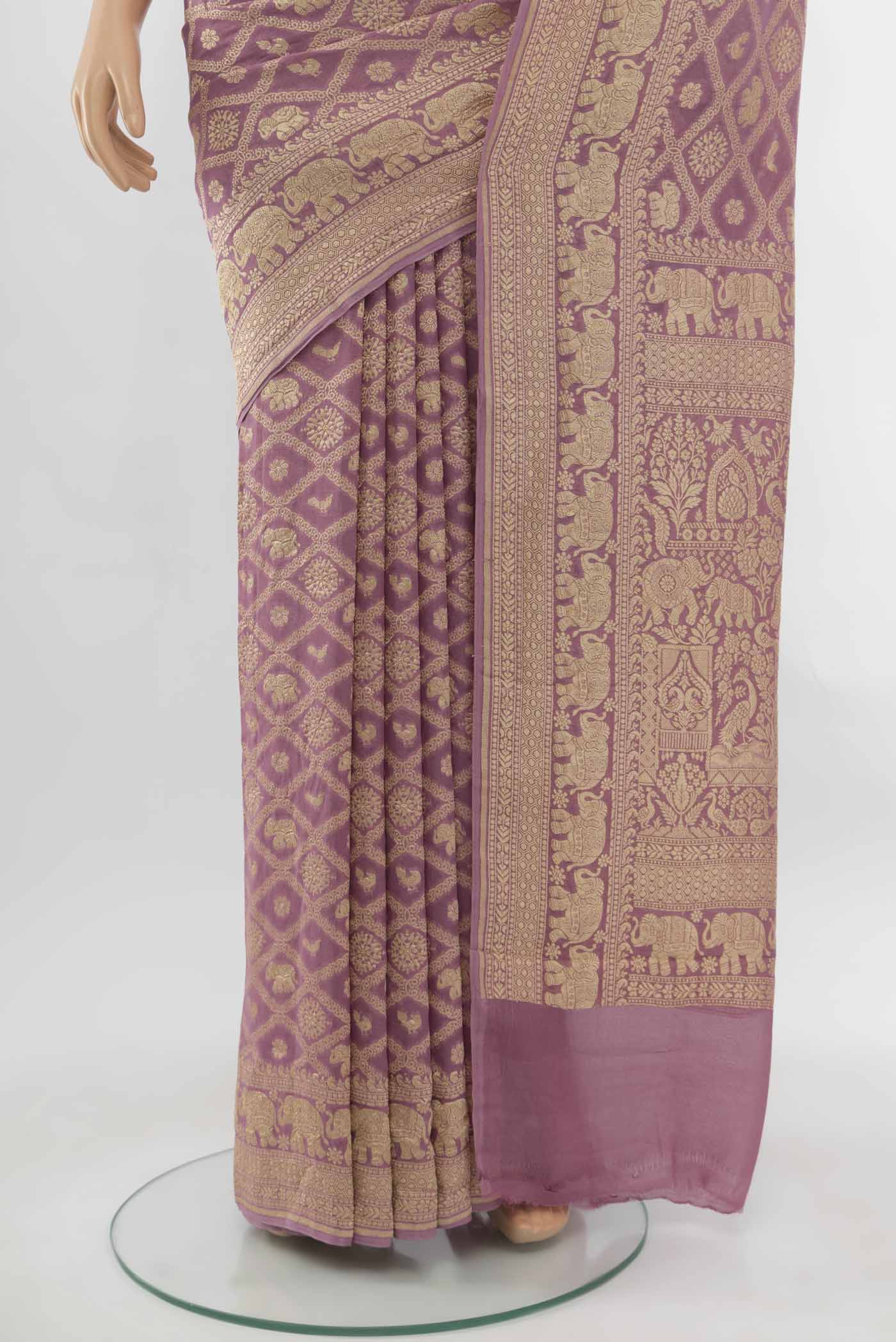 Pleats and pallu of Golden Banarasi Georgette Saree with Zari Butta on the body and Silk Border. 