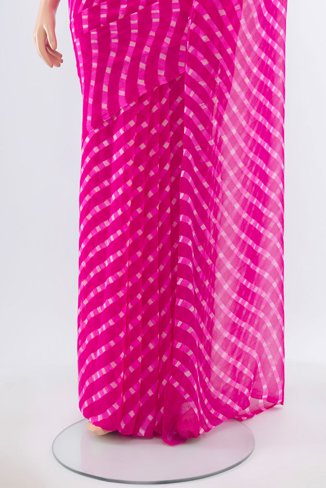 Pleats and pallu of Pure Silk Pure Zari Dark Pink Bandhani Georgette Saree with Bandhani on the body and Checks Border. 