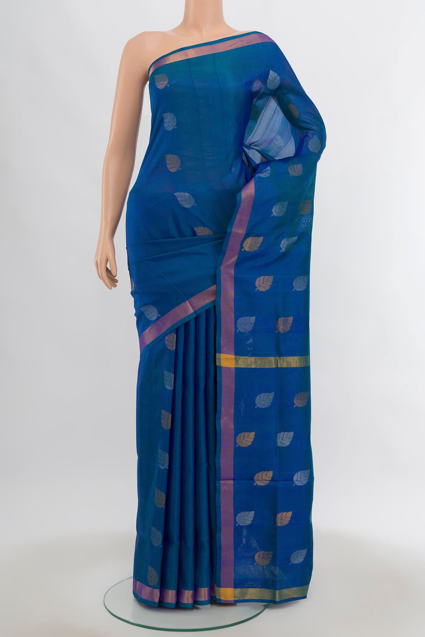 Dark Blue Uppada Silk Saree with Zari Butta on the body and Silk Border.  displayed on a mannequin