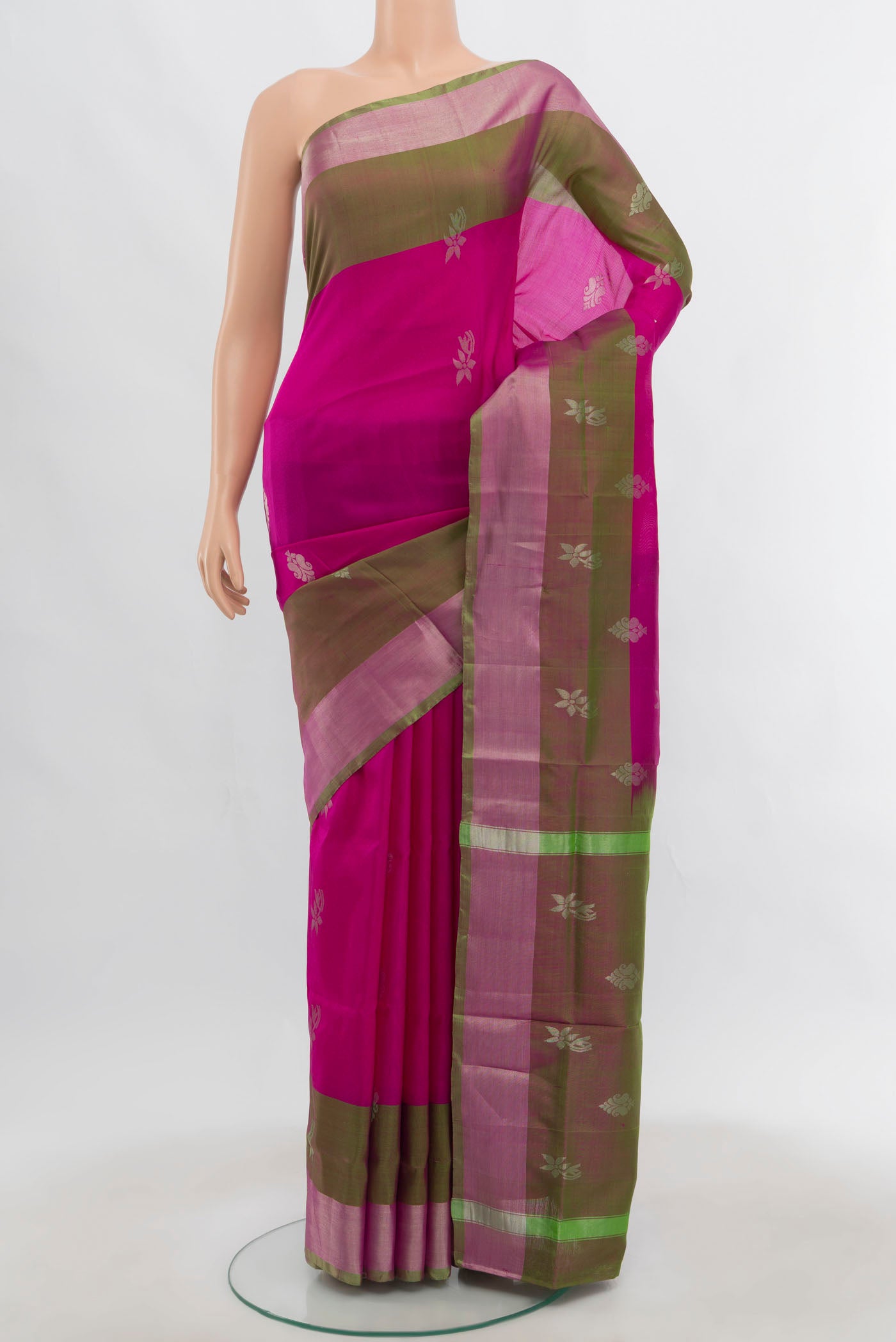 Magenta Uppada Silk Saree with Zari Butta on the body and Zari Border.  displayed on a mannequin