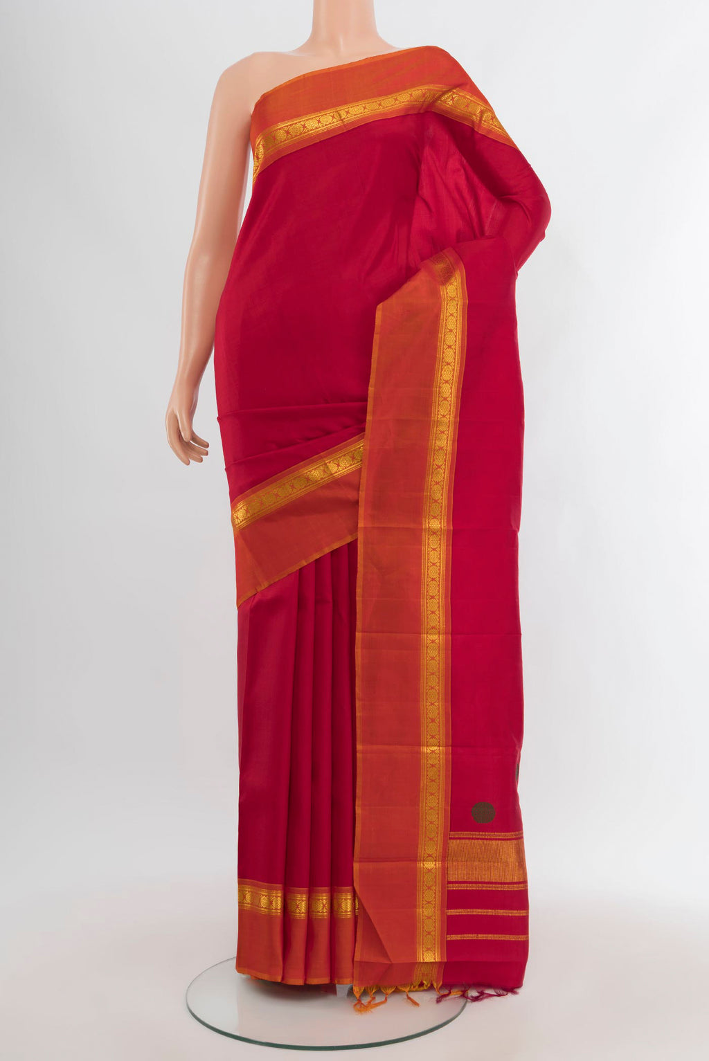 Maroon Kanchipuram Silk Saree with Plain Body and Zari Border.  displayed on a mannequin