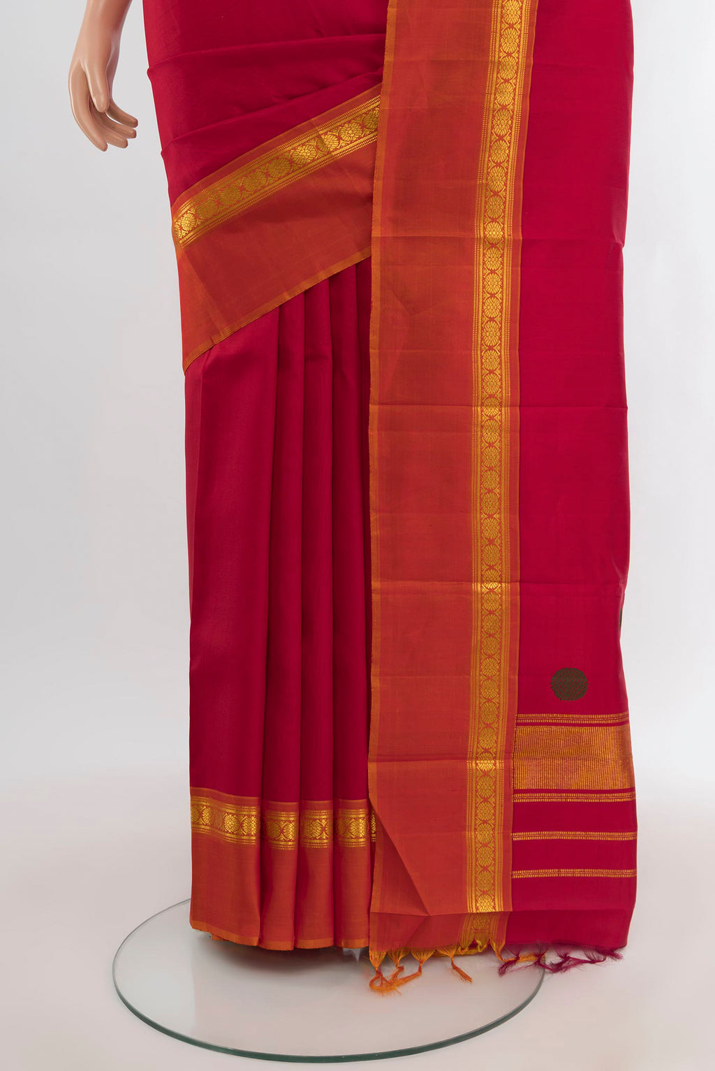 Pleats and pallu of Maroon Kanchipuram Silk Saree with Plain Body and Zari Border. 