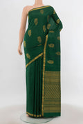 Bottle Green Kanchipuram Silk Saree with Zari Butta on the body and Silk Border.  displayed on a mannequin