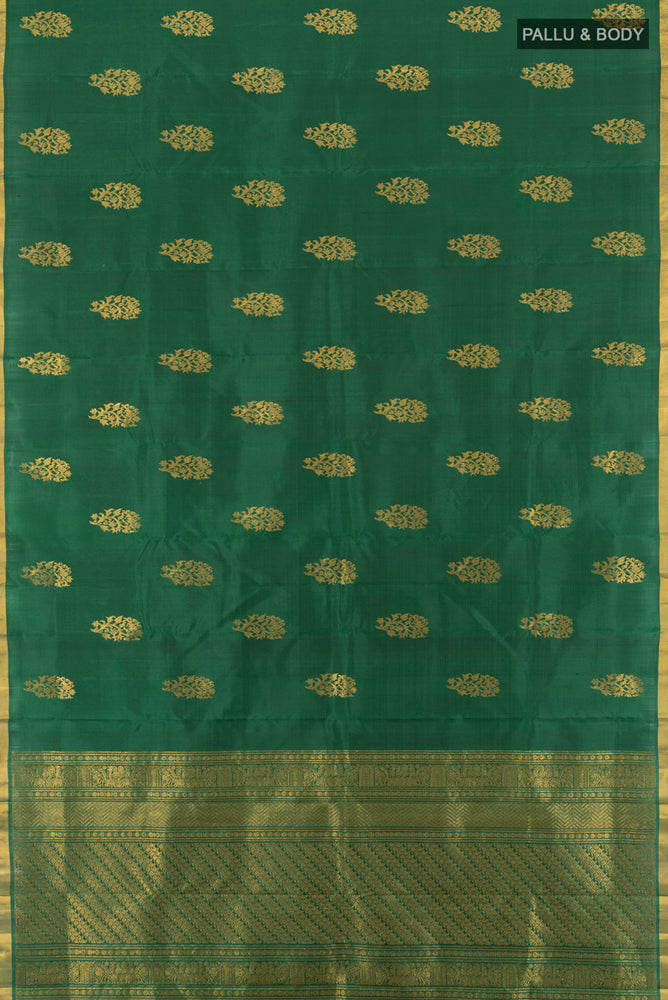 Flat view of Bottle Green Kanchipuram Silk Saree with Zari Butta on the body and Silk Border. 
