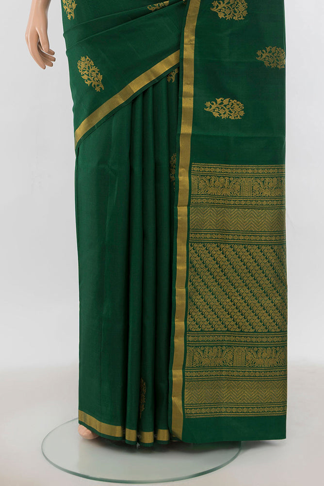 Pleats and pallu of Bottle Green Kanchipuram Silk Saree with Zari Butta on the body and Silk Border. 