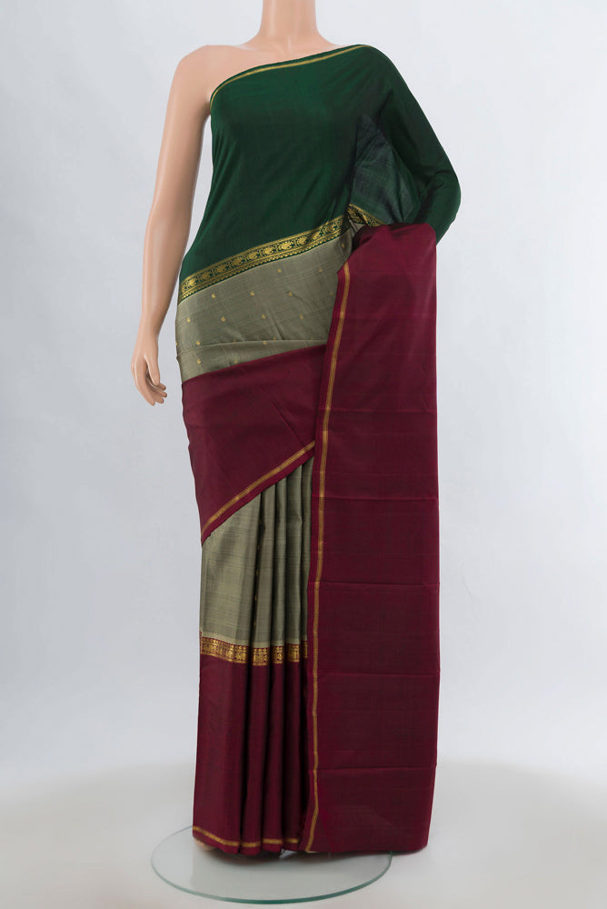 Multi Color Kanjivaram Silk Saree with Zari Brocade on the body and Silk Border.  displayed on a mannequin