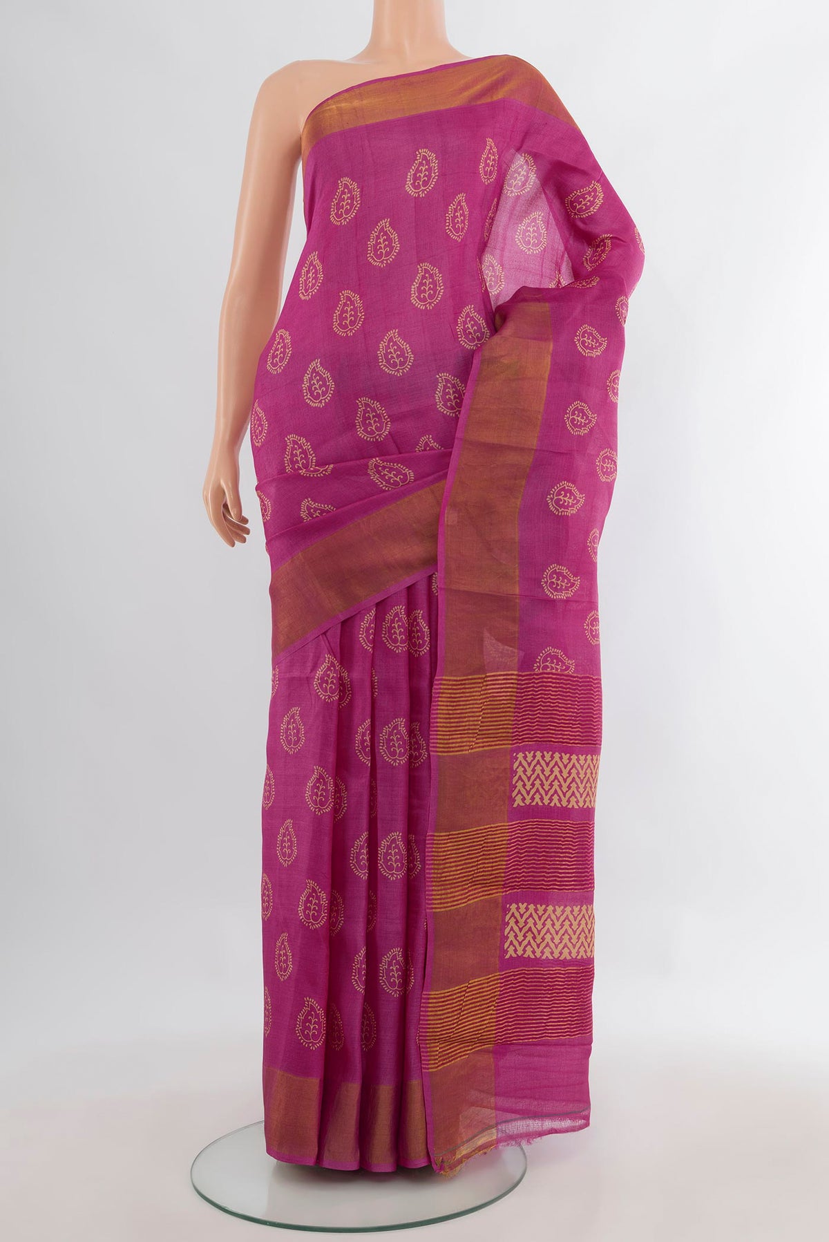 Pink Tussar Saree with Floral Print on the body and Zari Border.  displayed on a mannequin