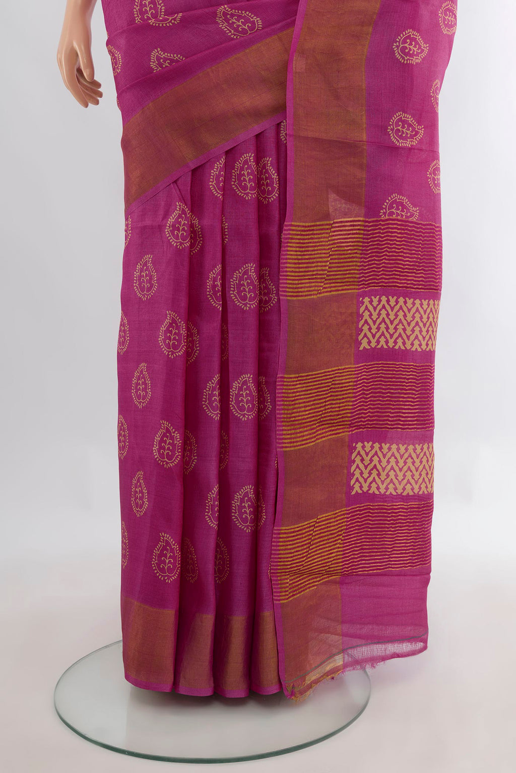 Pleats and pallu of Pink Tussar Saree with Floral Print on the body and Zari Border. 