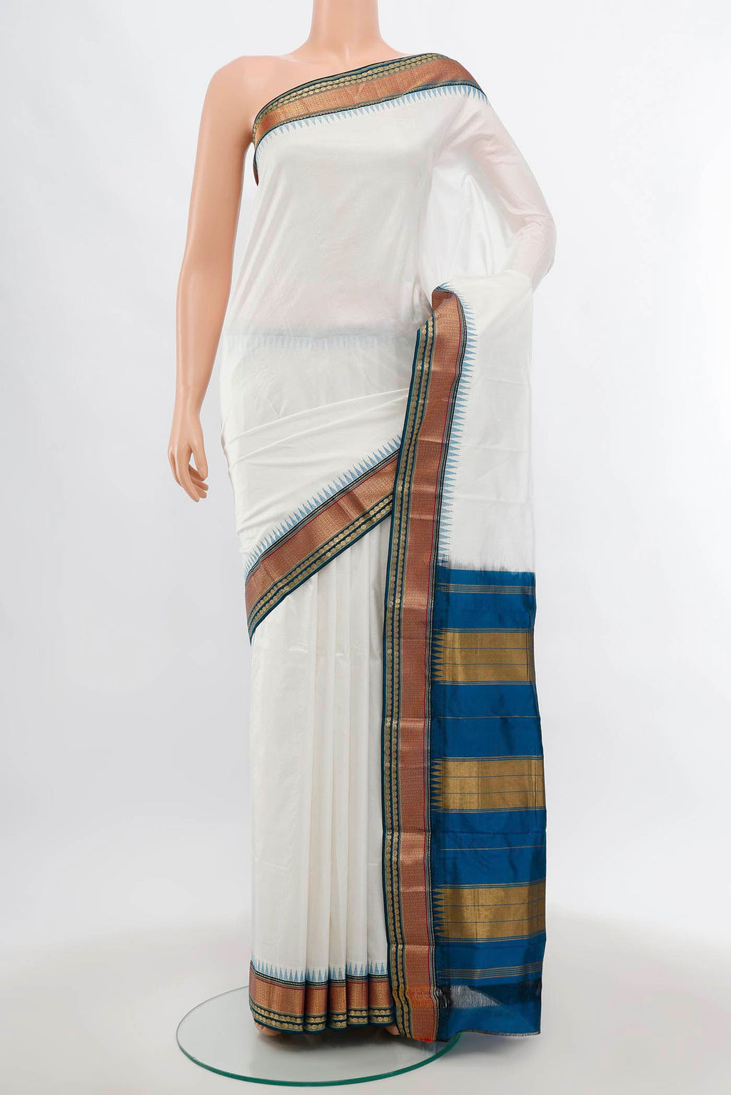 Off White Pochampally Saree with Zari Butta on the body and Silk Border.  displayed on a mannequin