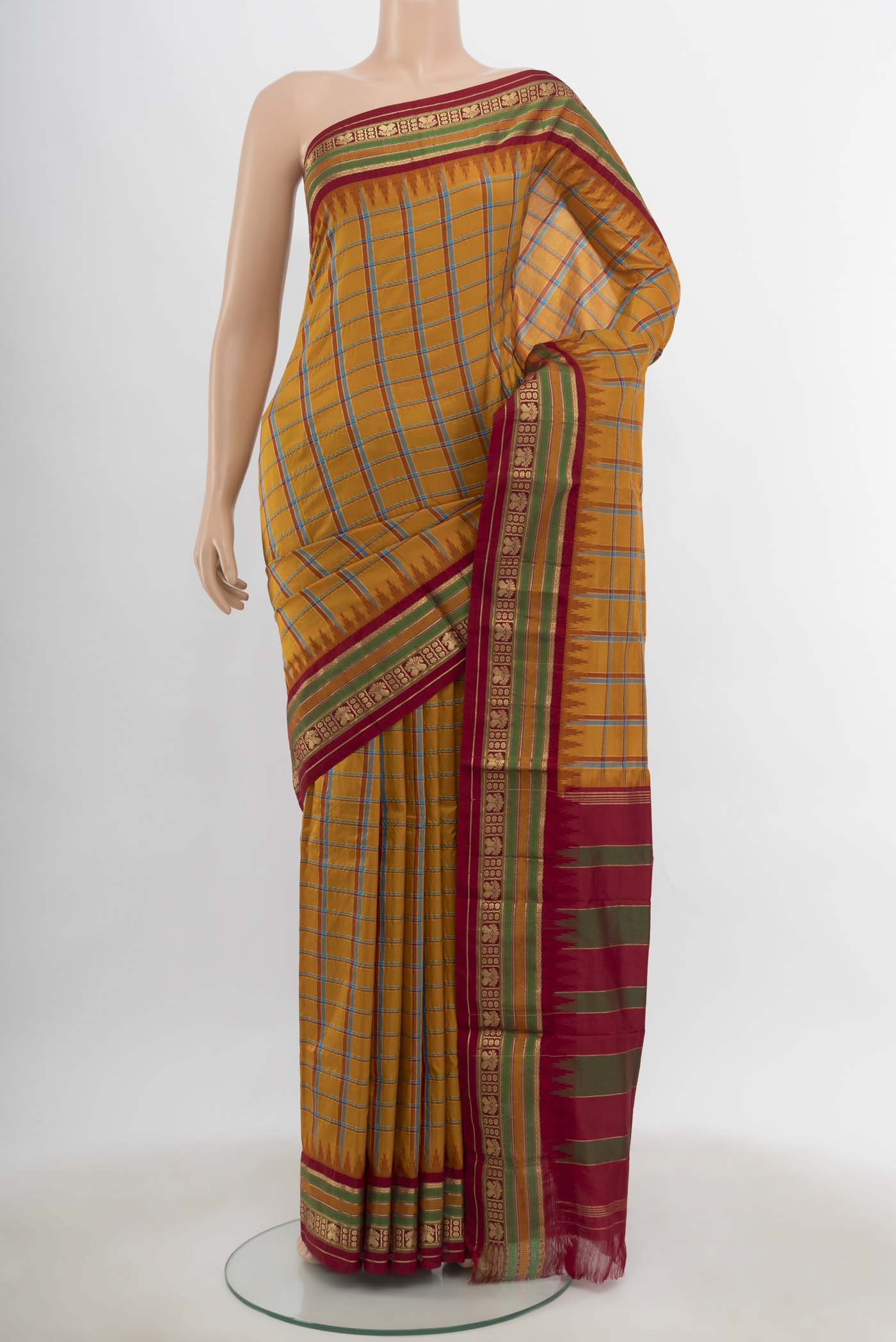 Mustard Bangalore Silk - kadyal Saree with Checked design on the body and Silk Border.  displayed on a mannequin