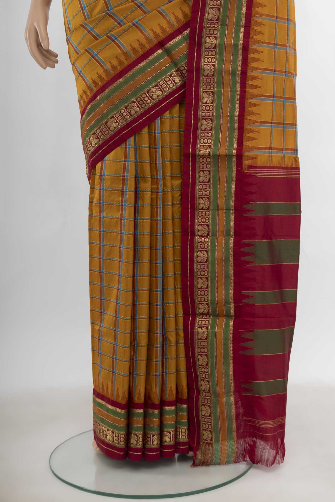 Pleats and pallu of Mustard Bangalore Silk - kadyal Saree with Checked design on the body and Silk Border. 