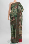 Green Tussar Silk Saree with Floral Print on the body and Zari Border.  displayed on a mannequin