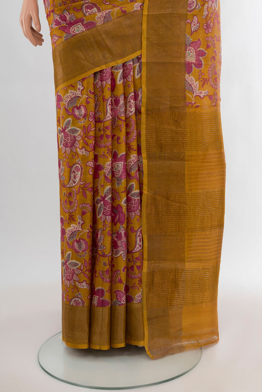 Pleats and pallu of Mustard Tussar Silk Saree with Floral Print on the body and Zari Border. 