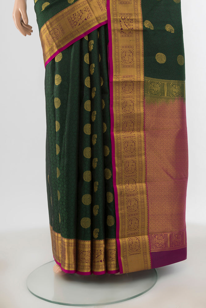 Pleats and pallu of Mint Green Kanchipuram Silk Saree with Zari Butta on the body and Silk Border. 
