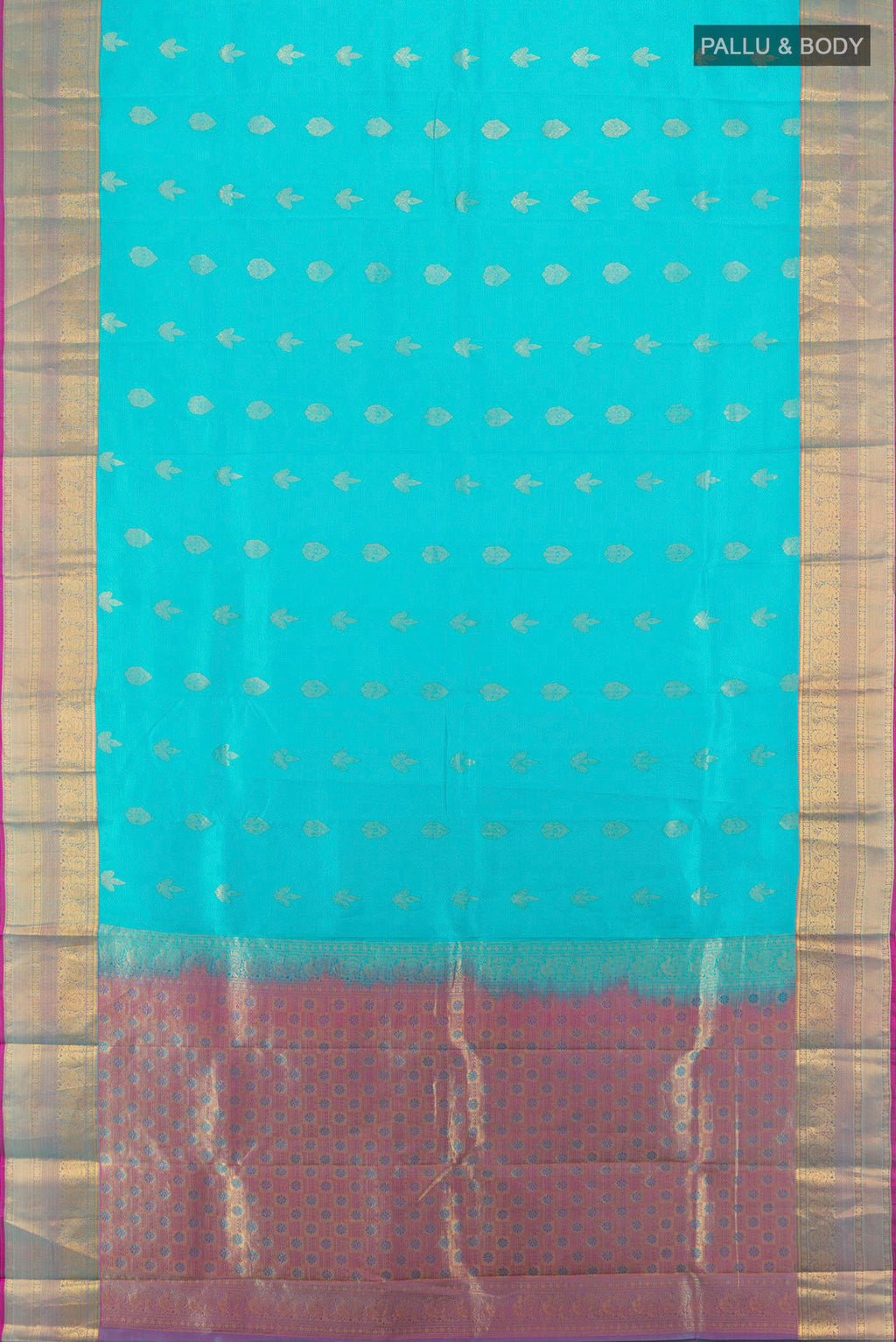 Flat view of Pure Silk Light Blue Kanchipuram Saree with Zari Butta on the body and Zari Border. 