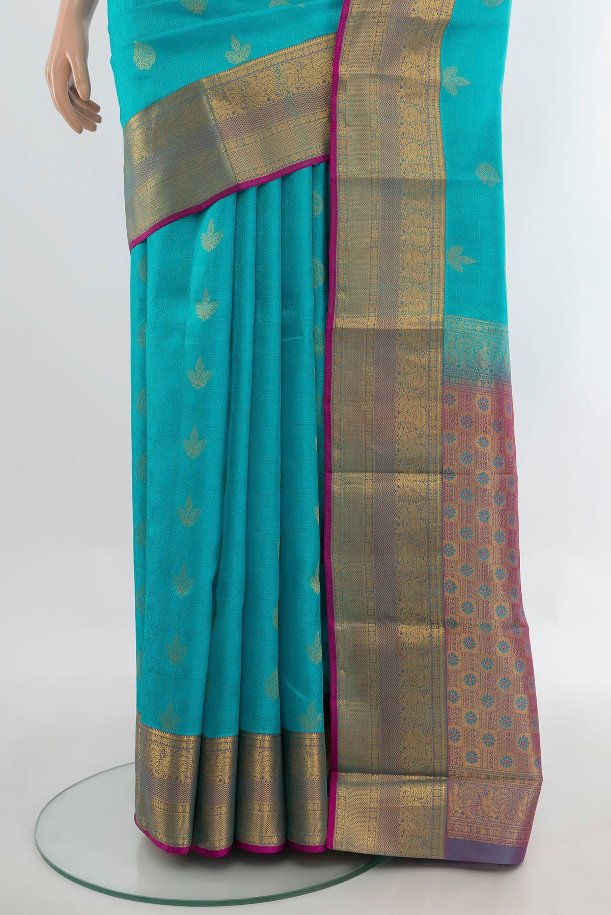 Pleats and pallu of Pure Silk Light Blue Kanchipuram Saree with Zari Butta on the body and Zari Border. 