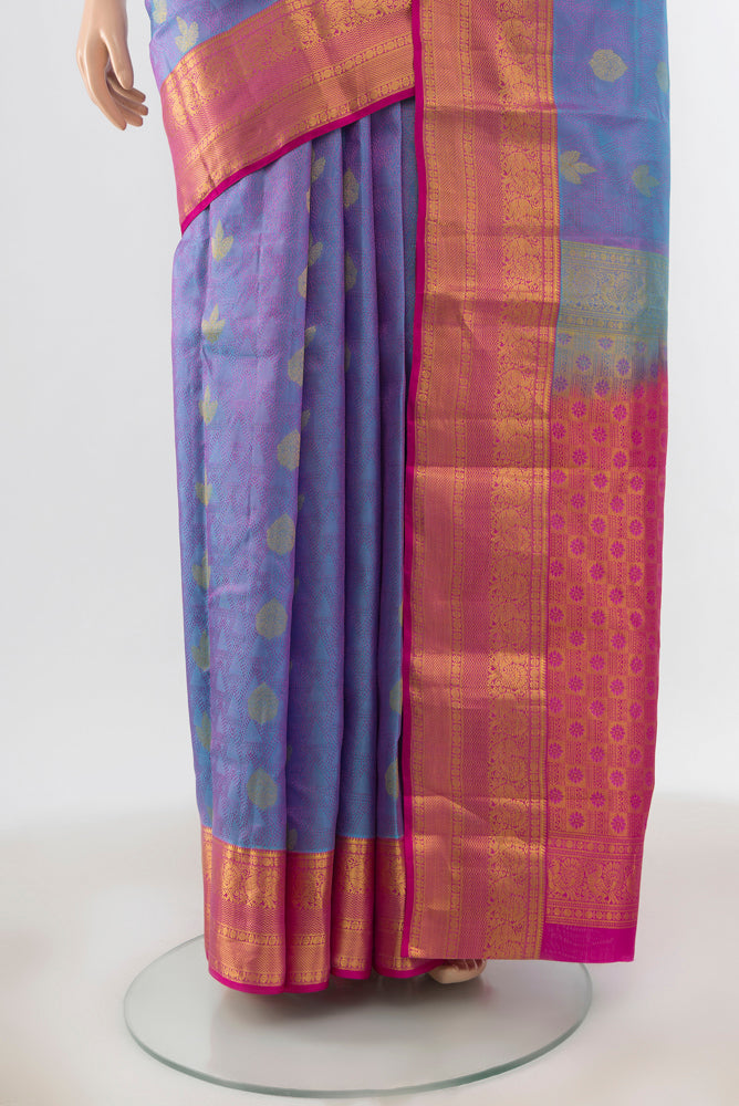 Pleats and pallu of Light Blue Kanchipuram Silk Saree with Zari Butta on the body and Silk Border. 