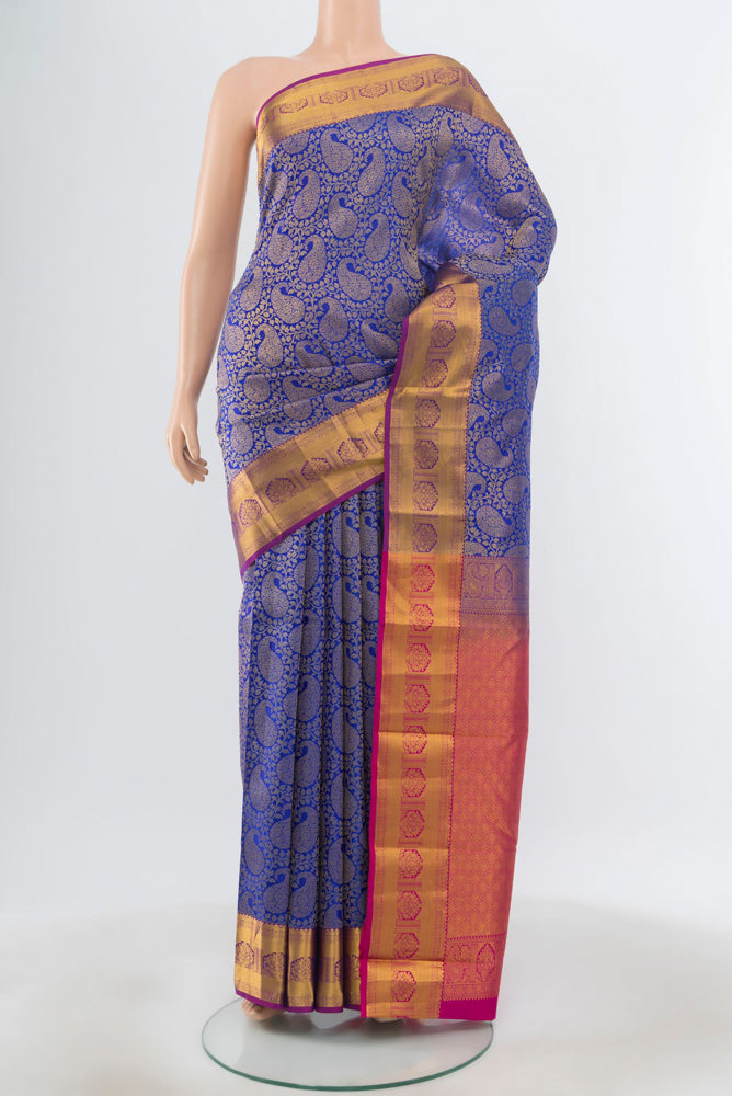 Pure Silk Pure Zari Dark Blue Kanchipuram Saree with Zari Butta on the body and Silk Border.  displayed on a mannequin