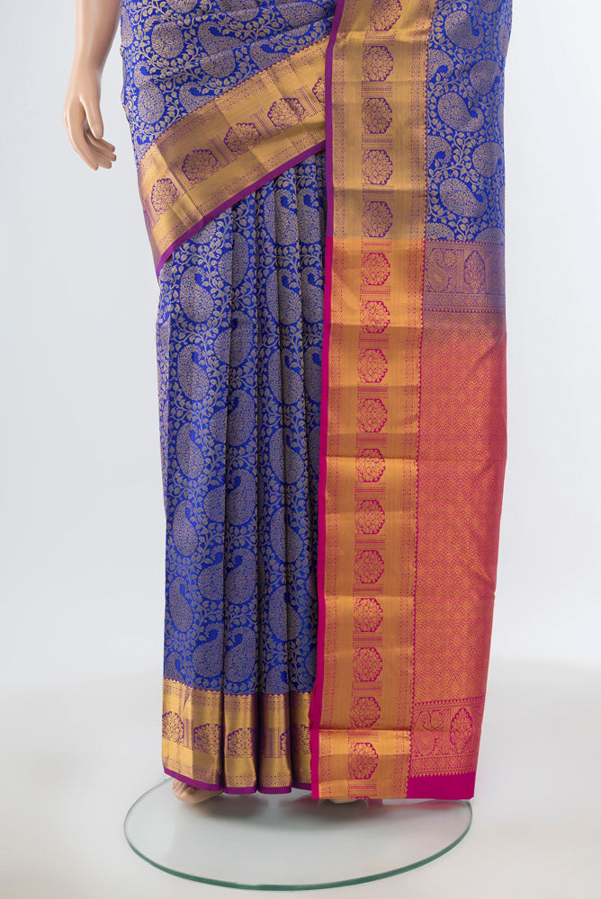 Pleats and pallu of Pure Silk Pure Zari Dark Blue Kanchipuram Saree with Zari Butta on the body and Silk Border. 
