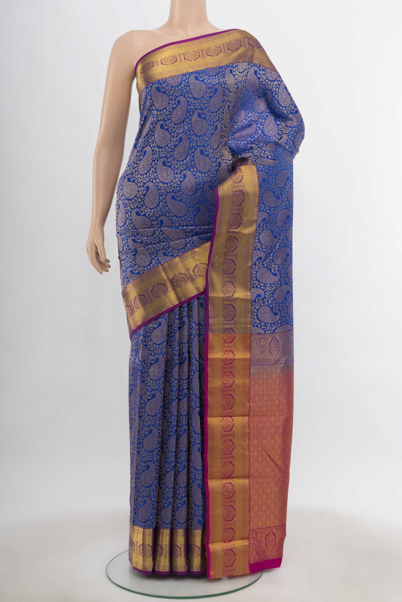 Dark Blue Kanchipuram Silk Saree with Zari Butta on the body and Silk Border.  displayed on a mannequin