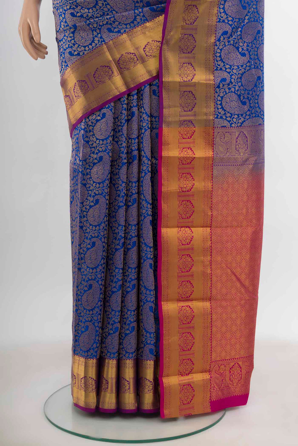 Pleats and pallu of Dark Blue Kanchipuram Silk Saree with Zari Butta on the body and Silk Border. 