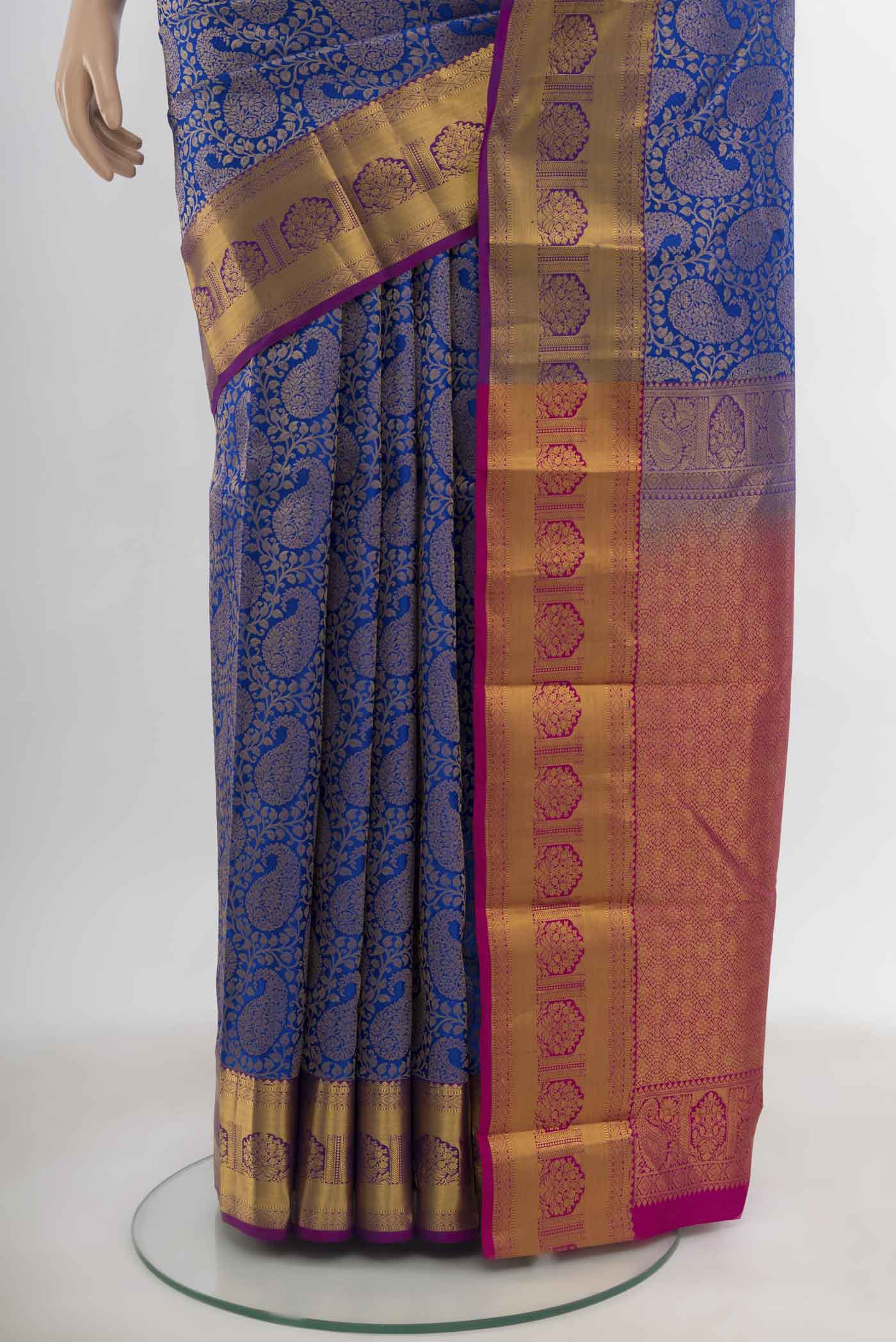 Pleats and pallu of Dark Blue Kanchipuram Silk Saree with Zari Butta on the body and Silk Border. 
