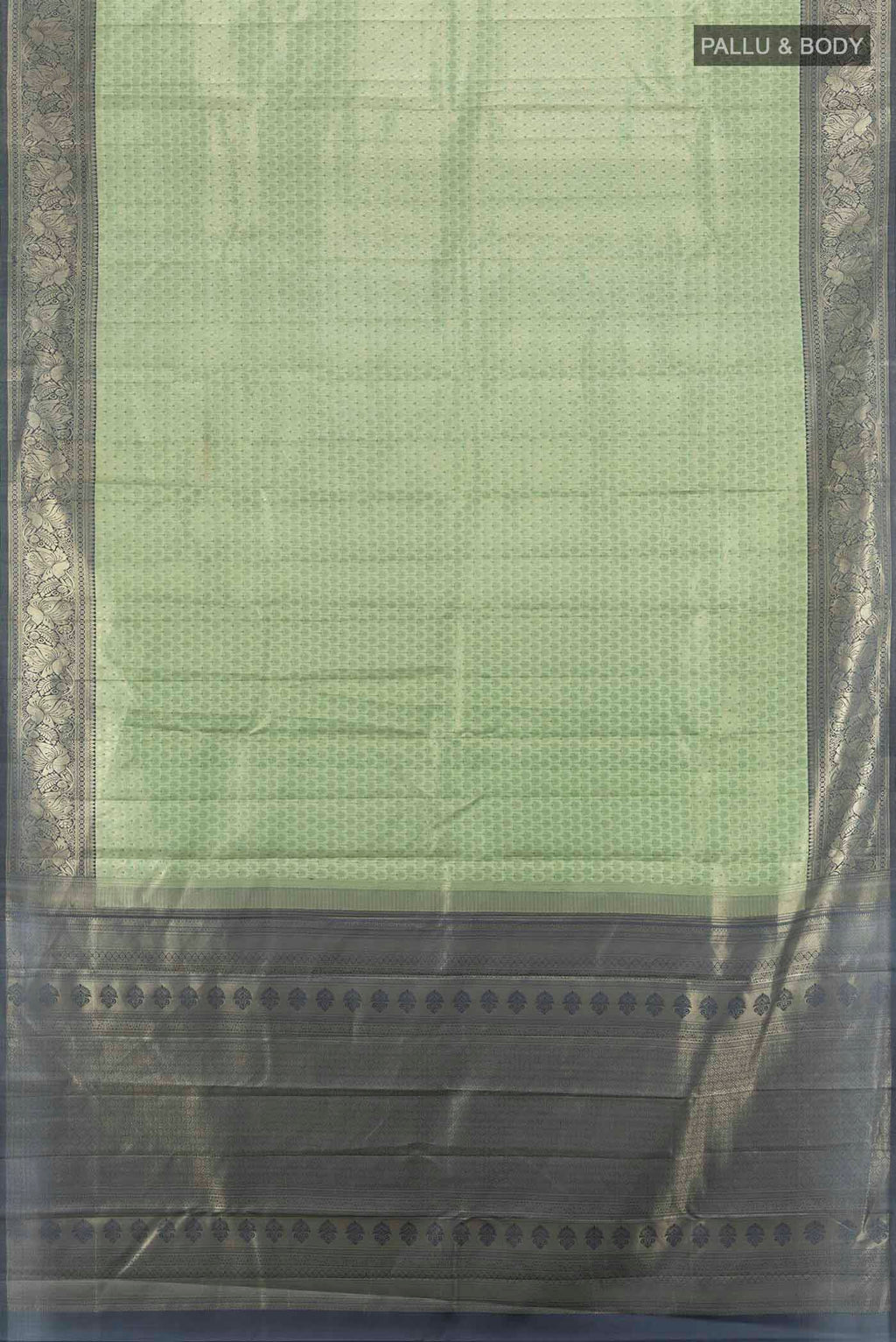 Flat view of Light Green Kanchipuram Silk Saree with Zari Butta on the body and Silk Border. 