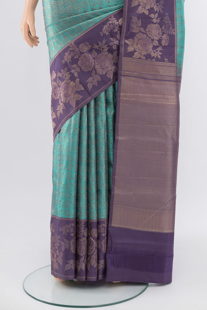 Pleats and pallu of Pure Silk Pure Zari Olive Green Kanchipuram Saree with Zari Butta on the body and Silk Border. 