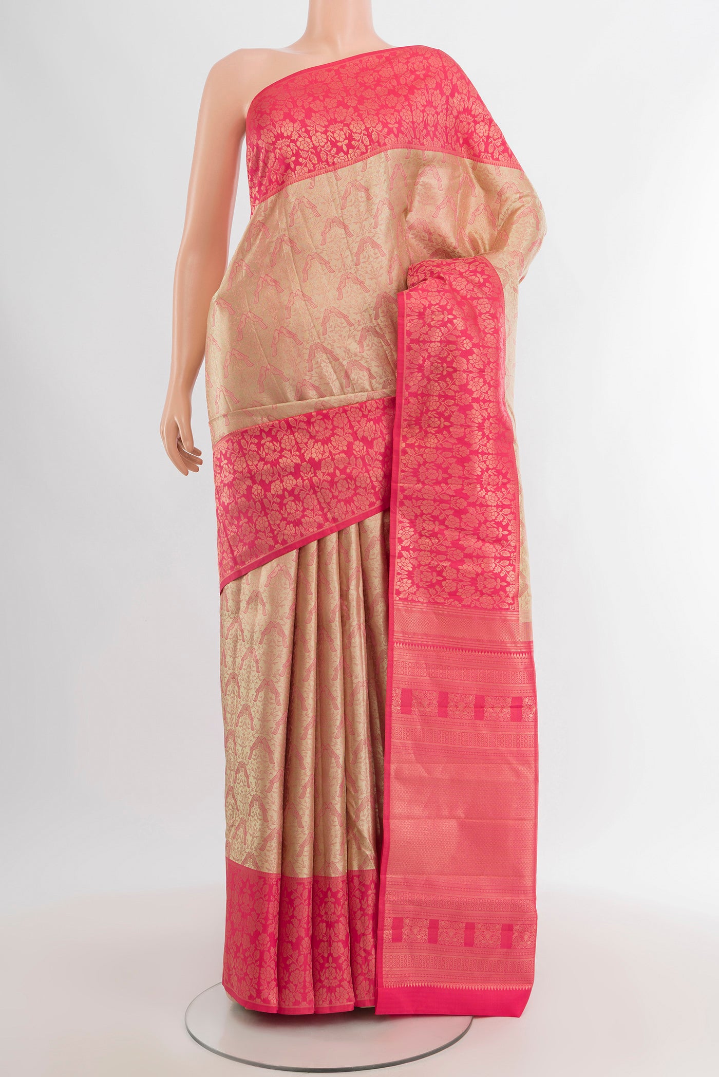 Rose Gold Kanchipuram Tissue Silk Saree with Zari Brocade on the body and Zari Border.  displayed on a mannequin