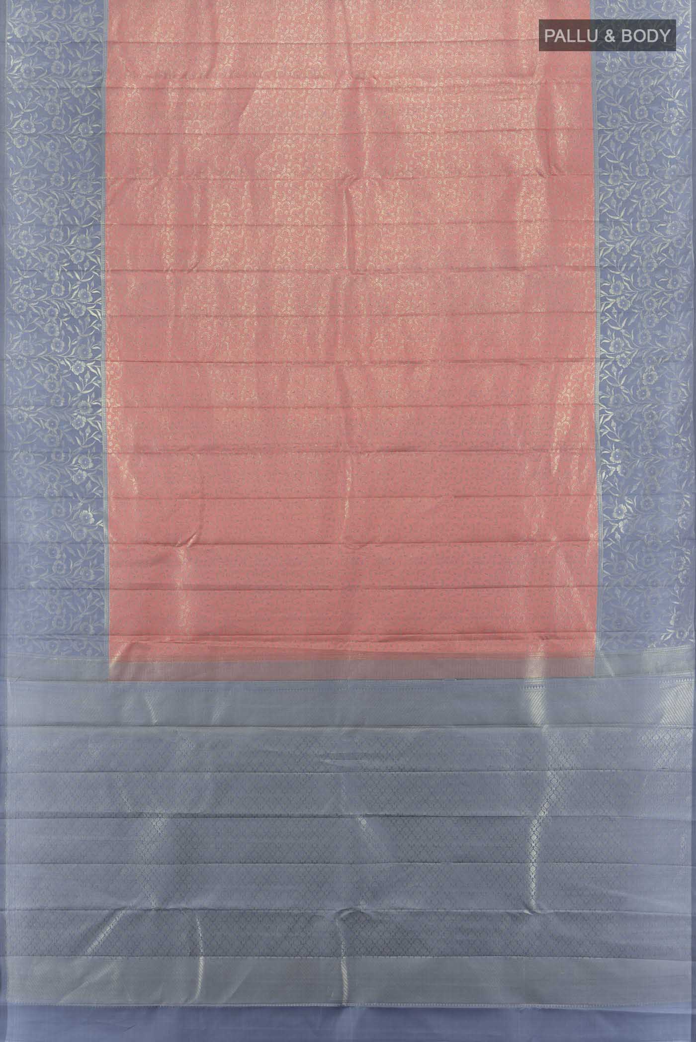 Flat view of Peach Kanchipuram Silk Saree with Zari Butta on the body and Silk Border. 