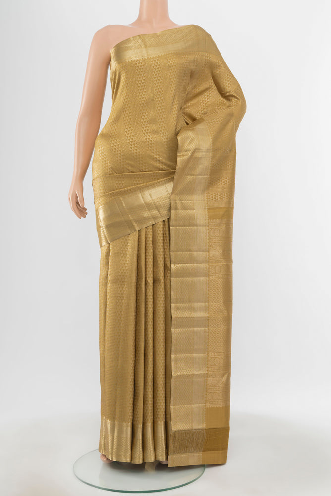 Pure Silk Pure Zari Golden Kanchipuram Saree with Zari Butta on the body and Silk Border.  displayed on a mannequin