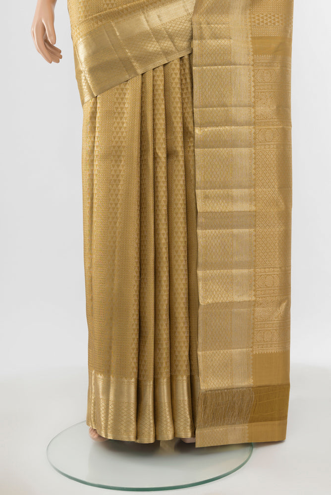 Pleats and pallu of Pure Silk Pure Zari Golden Kanchipuram Saree with Zari Butta on the body and Silk Border. 