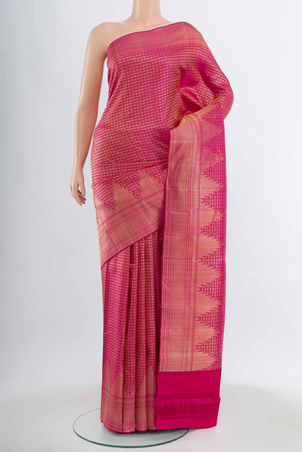 Magenta Kanchipuram Silk Saree with Zari Butta on the body and Silk Border.  displayed on a mannequin
