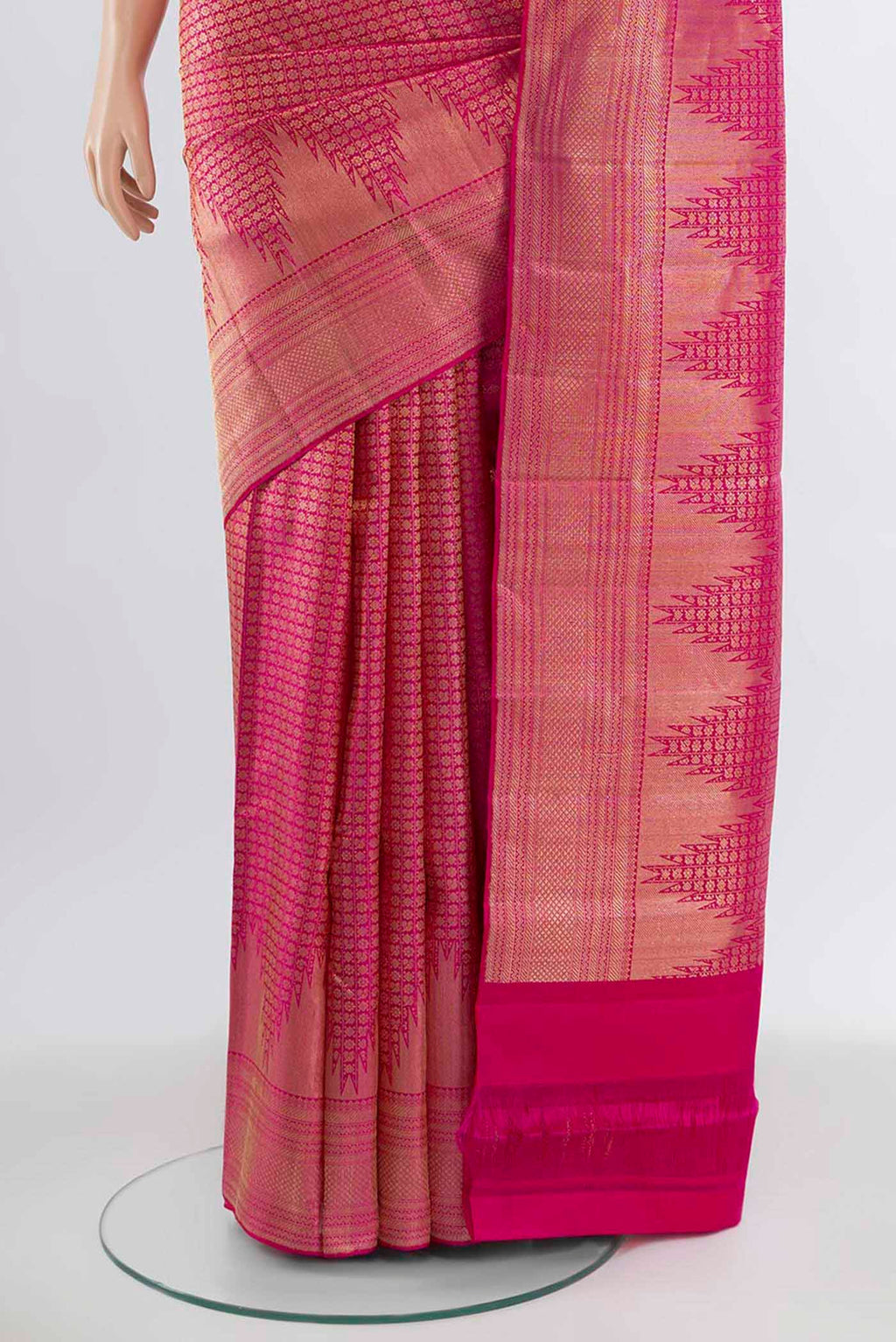 Pleats and pallu of Magenta Kanchipuram Silk Saree with Zari Butta on the body and Silk Border. 