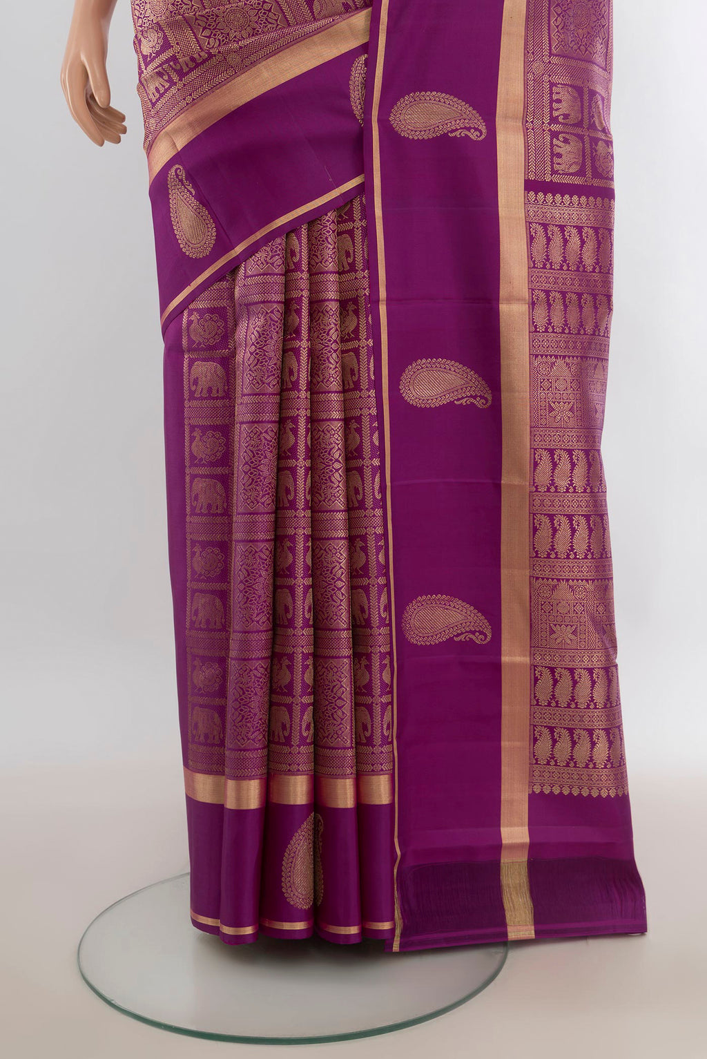 Pleats and pallu of Pure Silk Violet Kanchipuram Saree with Zari Butta on the body and Silk Border. 