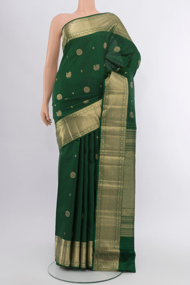 Bottle Green Kanjivaram Silk Saree with Checked design on the body and Silk Border.  displayed on a mannequin
