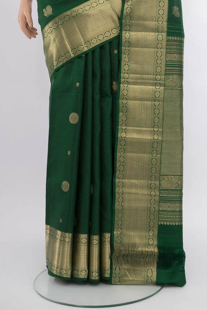Pleats and pallu of Bottle Green Kanjivaram Silk Saree with Checked design on the body and Silk Border. 