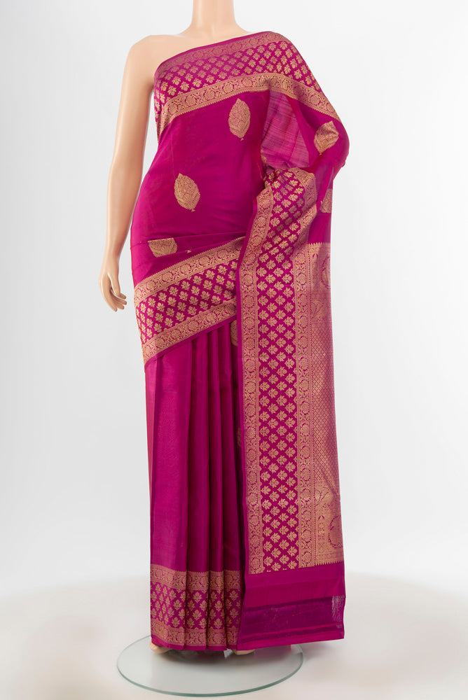 Pure Silk Pure Zari Purple Kanjivaram Saree with Zari Butta on the body and Silk Border.  displayed on a mannequin