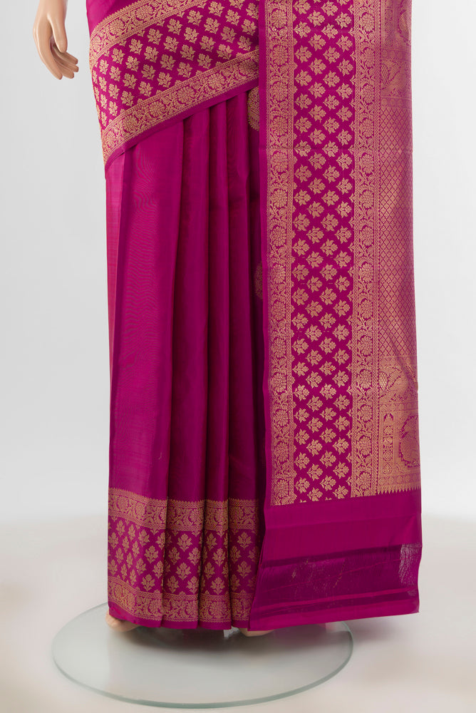 Pleats and pallu of Pure Silk Pure Zari Purple Kanjivaram Saree with Zari Butta on the body and Silk Border. 