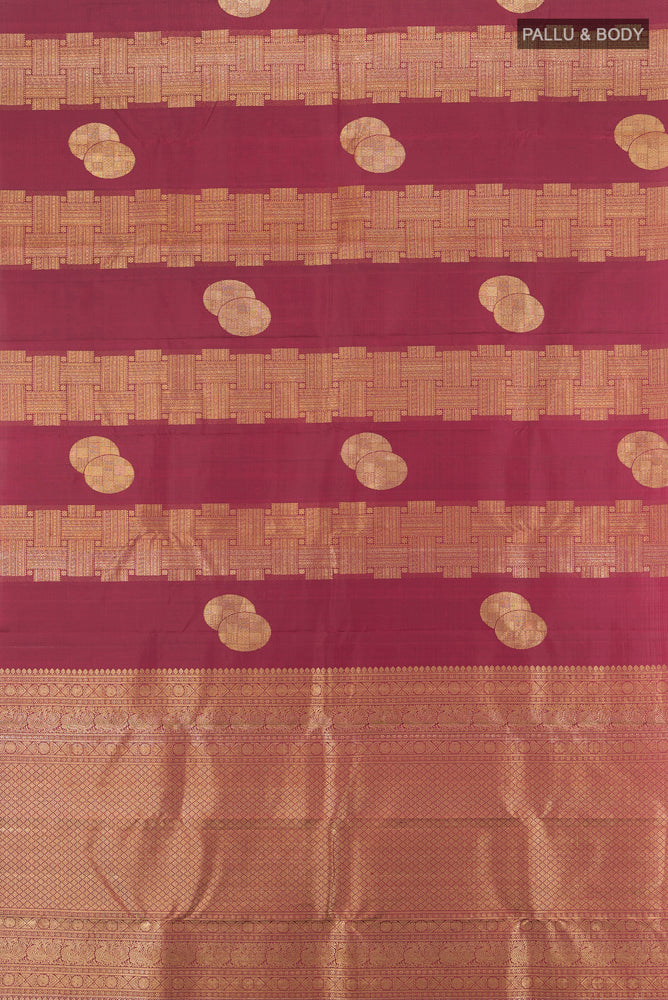 Flat view of Pure Silk Pure Zari Maroon Kanchipuram Saree with Zari Butta on the body and Silk Border. 