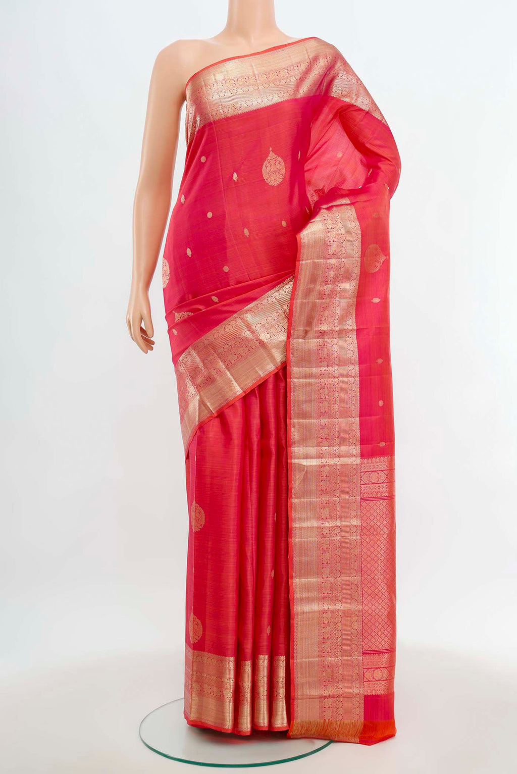 Rose pink Kanjivaram Silk Saree with Zari Butta on the body and Silk Border.  displayed on a mannequin